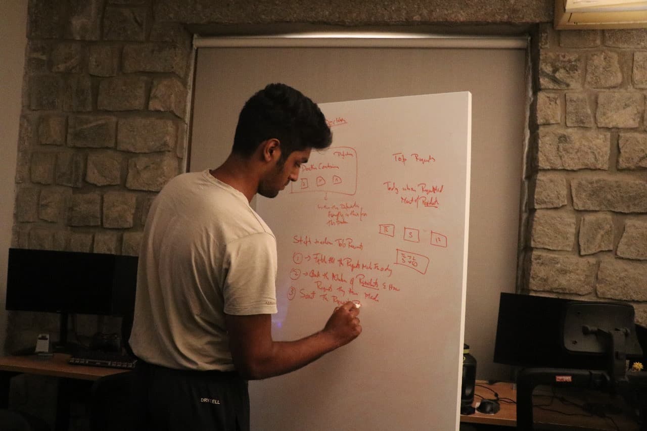 Sharikh Ahmed at a whiteboard